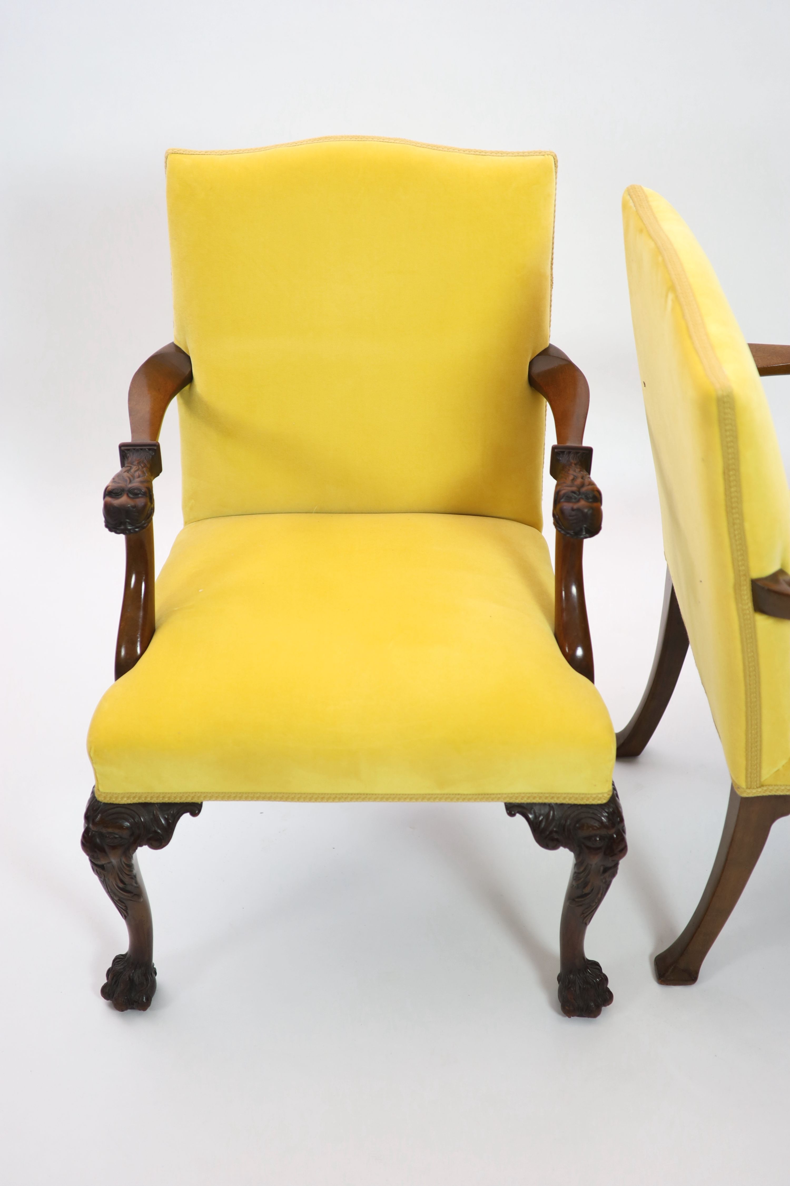 A pair of George II style mahogany elbow chairs, W.60cm D.60cm H.91cm